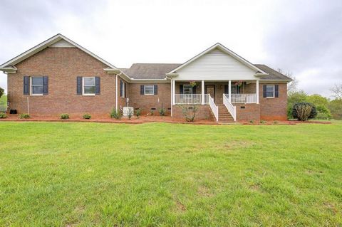 Nearly 2 acres of gorgeous Country Living in this All Brick Renovated Home! As you enter the long Drive notice the Large Front Porch ready for swinging or rocking chairs to enjoy the coming summer weather! You'll Love the Open Concept of the Main Liv...
