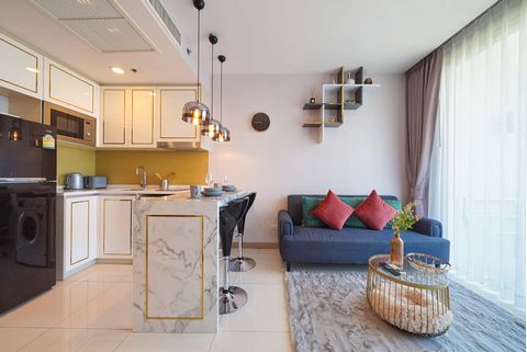 **Mieszkanie z 1 sypialnią w luksusowym wieżowcu** Położony w doskonałej okolicy na plaży Wongamat w Pattaya, projekt ten wyznacza złoty standard dla luksusowych kondominiów w Pattaya. Zaledwie 350 metrów od morza i otoczony restauracjami, kawiarniam...