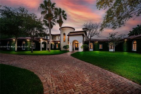 Nestled in a quiet no thru street is this magnificent custom-built estate in sought after Pinecrest. This home welcomes you with a double gated entrance and large Chicago brick driveway. Walk through the grand foyer and double doors which leads to a ...