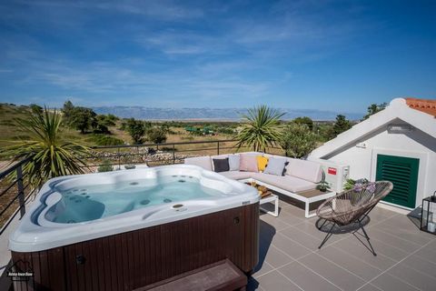 Holiday Home Diana has a swimming pool (21 m2), a terrace on the roof of the house with a jacuzzi and corner furniture. The terrace offers a view of the sea, untouched nature and the mountain Velebit. The house is brand new and moderly decorated.It i...