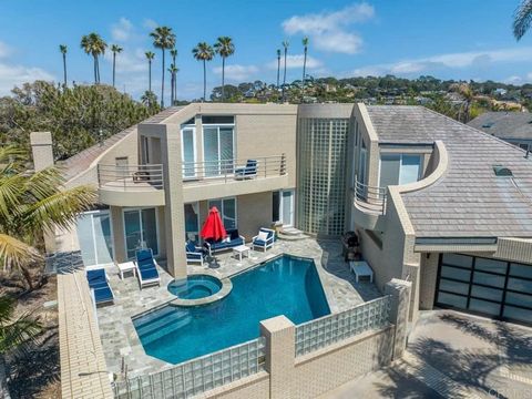 Sitting on 2 legal lots, 4,433 SQ FT living space, Modern Contemporary Styling, 5BR/6BA, located in the Beach Colony west of Camino Del Mar just about 200 feet to the oceanfront with direct beach access. Includes a 1BR/1BA guest suite or granny flat ...