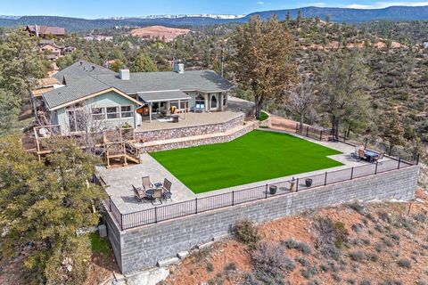 Country mountain living at its finest. This 2 acre horse property has direct access to the Tonto National forest. Gorgeous views of the Granite Dells huge 1200' paver patio area plus artificial turf yard perfect for outside living and entertaining. I...