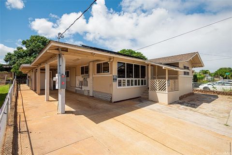Welcome to this spacious 5-bedroom, 3-full bath home located in the charming neighborhood of Waipahu. This home boasts an additional kitchen with 2 stoves and wet bar, perfect for large gatherings or dual living arrangements. Recently renovated with ...
