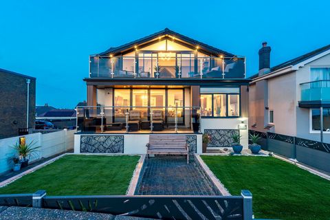 An Exquisite Coastal Residence with Unrivalled Sea Views – Moments from the Beach Nestled just 50 yards from the pristine shoreline, this extraordinary six-bedroom detached residence is a masterclass in luxury coastal living. Spanning three impeccabl...