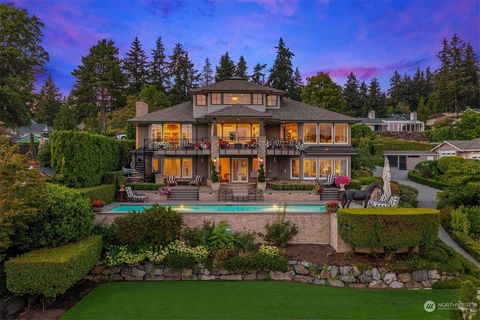 Private gated waterfront estate at the tip of Enatai regales you with the epitome of the waterfront lifestyle. The sunny southwestern exposure with 74ft of waterfront is perfect for poolside living & entertaining while highlighting dazzling Mt. Raini...