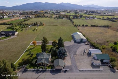 Welcome to the country! This immaculate home sits on just under 5 acres overlooking the Rathdrum Prairie and Mountains. Further, this home has been recently remodeled in the last several years with beautiful granite counters and Kitchen Aid appliance...