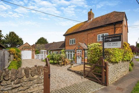 A beautiful period character cottage tastefully maintained and improved but retaining the authenticity of its original features including oak timbers and floors and a feature fireplace with oak mantle and bread oven incorporating a log burning stove....