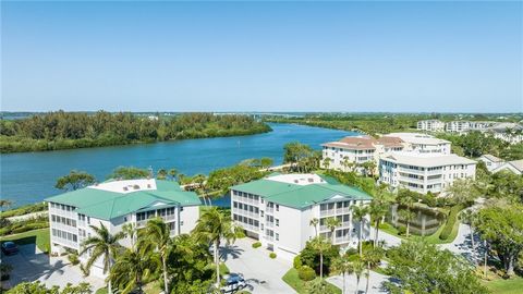 Elegant Riverfront condo with stunning river and sunset views. Private elevator entry, lovely wraparound covered patio for alfresco dining and entertaining, spacious open floor plan, wonderful kitchen with center island, luxurious master suite, den w...