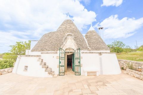 PUGLIA . CISTERNINO. PANORAMIC TRULLI Coldwell Banker offers for sale, exclusively, an enchanting complex of trulli immersed in the green countryside of Cisternino, a well-known center of the Itria Valley in Puglia. The external landscape is wonderfu...