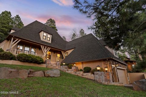 Live in an extraordinary, storybook-like custom home in the heart of downtown Flagstaff, surrounded by a .5 acre forested homesite that transports you into timeless beauty. From its stunning Tudor curb appeal to the panoramic view from Inspiration Po...