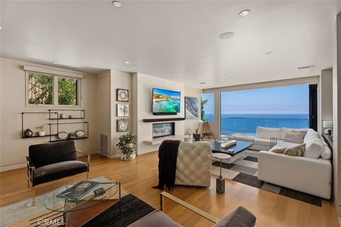 Experience the pinnacle of coastal living with this exceptional opportunity in Laguna Beach's coveted Coast Royal neighborhood. This contemporary residence, designed with masterful elegance and modern luxury, offers breathtaking Pacific Ocean, Catali...