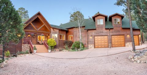 Escape the hustle & bustle of city life with this rustic, custom built real wood cabin surrounded by ponderosa pines, NEW ROOF (2023) exceptional millwork t/o, large wooden columns, ambient accent lighting, a stunning deck that spans the entire lengt...