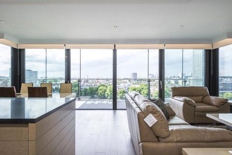 Contemporary 2 double bedroom, 2-bathroom apartment on the 12th floor of this new development. Residents benefit from shared roof terrace and concierge service. This apartment enjoys direct river views from its private balcony and comprises walk-in w...