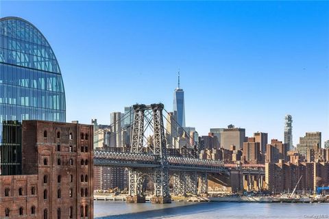 Gut-Renovated Pre-War Williamsburg Loft w/ Unobstructed Manhattan Skyline Views 18-foot ceilings, Japanese-inspired primary loft suite, and high-end finishes at the historic Esquire Building seconds from Domino Park.Experience an authentic loft lifes...