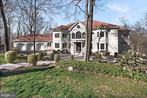 Constructed by the present owners in 2001, this custom-built property was designed to accommodate extensive social gatherings while offering resort-like amenities for both relaxation and athletic activities. Situated on two woodsy acres, the residenc...