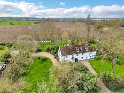 This captivating Grade II Listed Suffolk long house is brimming with personality, charm and authentic features. This sizeable home offers six comfortable bedrooms, an inviting open plan sitting room, a fine drawing room and grounds of approximately o...