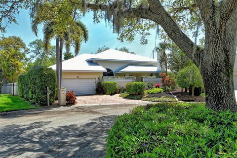 Enjoy waterfront living in this exquisite luxury canal property! Follow the paver driveway through Florida-friendly landscaping and iron gate to the private courtyard. As you enter the etched glass double doors, soaring tray ceilings and custom archi...