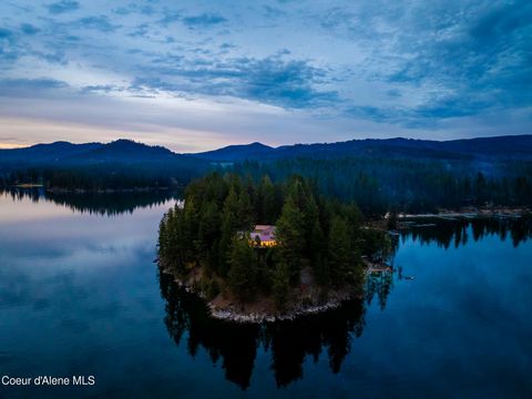 Nestled upon the serene shores of Hayden Lake, this exquisite waterfront estate offers the epitome of luxury living on its very own secluded peninsula. With unparalleled privacy and breathtaking natural beauty, this property is a true sanctuary for t...