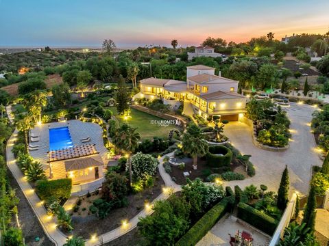 This five bedroom villa for sale is located in Loulé, set within an expansive 8,174m2 plot and offering luxury living at its finest. Boasting sophistication at every turn, the property spans two floors and comes fully furnished, showcasing tasteful d...