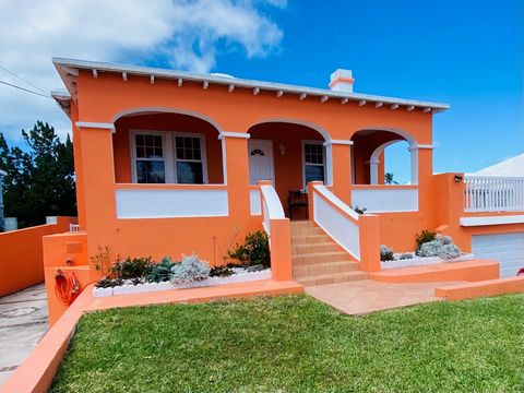 Walk right in and unpack your things! This traditional Bermuda Cottage is in excellent condition, just waiting for a new family to enjoy all that it has to offer. The welcoming arms staircase leads to a spacious covered front patio with distant views...