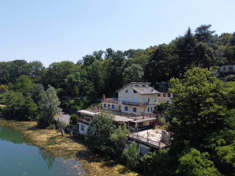 For sale in Avigliana, in a quiet area, we offer a large commercial space located on the shores of Lago Grande. Built in the 70s, the property needs a complete renovation and is made up as follows. The ground floor, measuring approximately 425 m2, wa...
