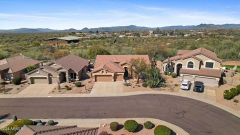 Welcome to your turn-key dream home in the serene landscape of Cave Creek, Arizona! Wake up to views of Black Mountain, and cozy up next to one of your 2 fireplaces. Architect designed and owned. This exquisitely remodeled residence boasts an ultra-c...