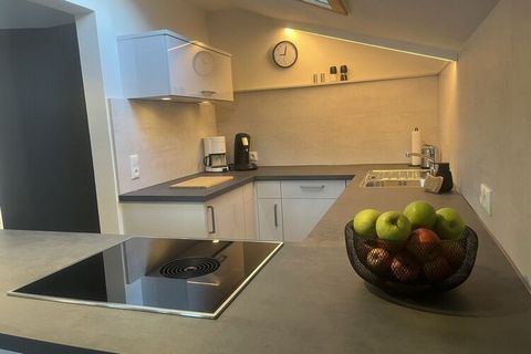 Our holiday apartment has been completely renovated and modernized. The open kitchen offers a beautiful view of the dining/living area.