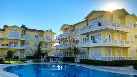 Appartement d'investissement meublé dans un complexe avec piscine à Belek L'appartement est situé dans le quartier de Belek à Antaly, la région qui abrite des terrains de golf de renommée mondiale. La région, composée d'hôtels golfiques renommés, pre...