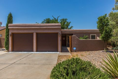Modern Pueblo-style home in desirable La Cueva district. From the private courtyard to the open layout, this home is truly captivating! This single-story home features 3BD/2BA. Enjoy the beautiful master retreat with upgraded bath & elegant barn door...
