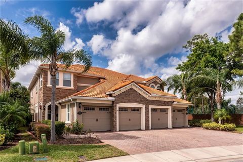 Expect to be impressed with this 4BR luxury townhome in Point Cypress, a secure gated community. It starts with great curb appeal – attractive façade w/stonework accents, tile roof, paver driveway and lush landscaping. Step inside to common living sp...