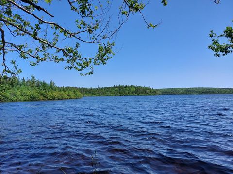 Cape Breton. 6475sq.m  Building Lot 3 Bjoern Seelhorst Dr. with 80m waterfront is located in a beautiful location right at MacLeods Lake. Aprox. 140m Roadfrontage. Migrated, surveyed, power is on the roadside, ready to build on. The property slopes g...