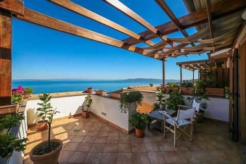 Porto Santo Stefano. Inside an elegant recently built condominium, we offer a penthouse floor with an amazing sea view The newly built apartment boasts minimal, elegant, valuable and refined finishes. Large living room with fireplace and large window...
