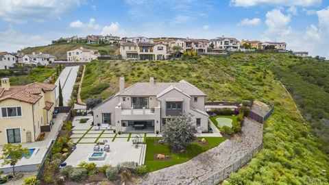 GORGEOUS, PANORAMIC VIEW PROPERTY IN THE PREEMINENT GATED COMMUNITY OF THE ESTATES AT SAN ELIJO HILLS. Situated on 1.3 acres with fabulous hill and ocean views, this impeccably crafted, highly upgraded 4BR/3.5BA home, includes a large downstairs bedr...
