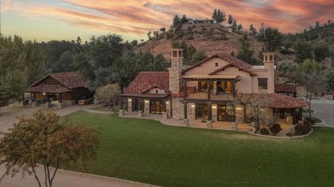 Experience the epitome of luxury living in this exquisitely handcrafted home nestled on 4.5 acres, offering stunning views of the Granite Dell Mountains, bordering National Forest and the common area. The allure of this property is accentuated by a f...