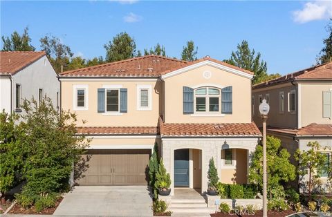 This gorgeous home is located in the highly coveted guard gated community of Orchard Hills in Irvine. The highlight of this property is the enviable private location with no neighbors behind and with a view of community olive trees. Waking up from th...