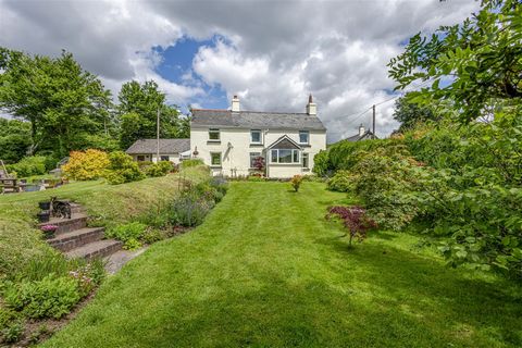 Set within Dartmoor National Park, Lane End Cottage is a charming five-bedroom detached country home located just a stone's throw from the open moorland. Nearly every room boasts stunning views of Dartmoor and the surrounding countryside, while the f...