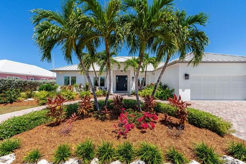 Tranquility awaits at this captivating, waterfront 4-bedroom plus office and oversized den, 4 bathroom home which effortlessly blends comfort and casual elegance. Located in the gated community of The Shores, you'll discover tennis courts, beautiful ...