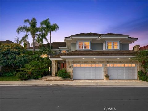 Welcome to 3 Weybridge, an exquisite custom estate nestled in the prestigious guard-gated community of Belcourt, located in the heart of Newport Beach. This grand residence spans approximately 6,500 square feet of luxurious living space, offering a s...