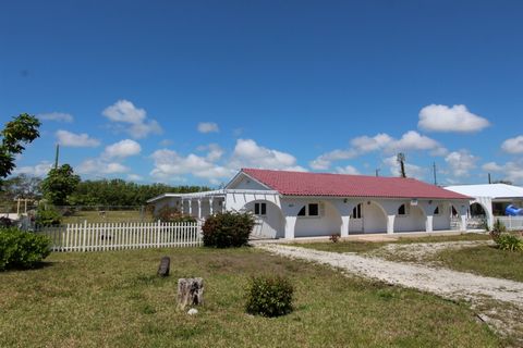 Located in the highest elevated area. (The Ridge) on the island of Grand Bahama, this beautiful three bedroom/two bathroom 2,500 sq foot family home sits in a very safe area that has been well desired historically. The building is strong structurally...