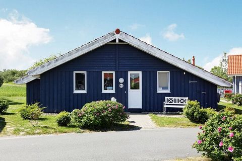 1st row. Luxuriously furnished Danish wooden holiday home located directly by one of the lakes in the Water and Landscape Park Otterndorf. The modern furniture and the bright, wood-paneled walls and sloping ceilings give the house a bright and friend...