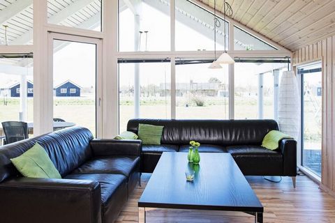 Skanlux holiday cottage with 25 m² activity room with billiards and table tennis. There is a DVD player and cable TV. For the children there is cot and high chair and outside there are swings and a sandpit. 2 bathrooms, one has a 2 person whirlpool a...
