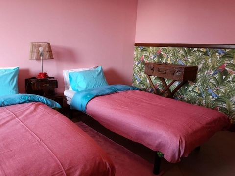The Bedroom has a balcony, a private bathroom, hanging clothing space and a dresser. A king size bed, workplace and heating is also available. Welcome to the historical center of Braga! The Chaplain house has been recently renovated, and its surround...