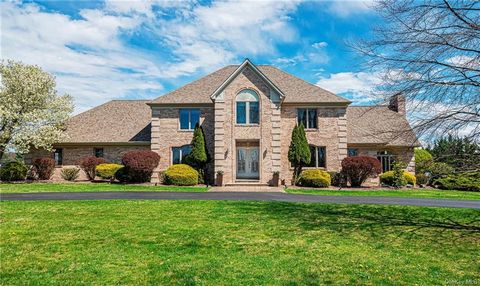 The impressive winding driveway bordered by mature landscaping and full grown trees brings you to this picturesque, sleek and very spacious custom colonial... a Must See. Brimming with style, elegant upgrades, a classic design and flawless features, ...