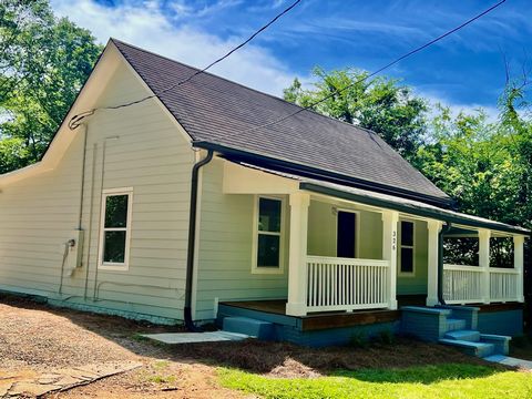 Historic, circa 1930, intown 3/2 cottage with wrap around, rocking chair front porch. Recently updated. The large common living area on the front interior has 2 doors that open to front porch. There's a master suite, and 2 secondary bedrooms. Located...