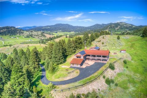 Exquisite Custom Home with Breathtaking Mountain Views at 2355 Sawmill Rd. Discover the epitome of luxury living at 2355 Sawmill Rd, a magnificent custom-built home spanning over 5500 square feet and situated on 11.6 acres of pristine land in the stu...