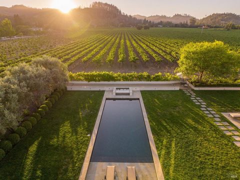 This exceptional estate, sited within a private 0.72 +/- acre in-town oasis, offers rare and expansive vineyard views stretching all the way to the foot of Spring Mountain. Located within St. Helena's westside rural corridor between the lands of Spot...