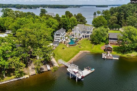 There is no other property on Lake Murray like 220 Old Forge Road. Located in Chapin, South Carolina, this luxurious, resort style home offers a 4,736 sqft main house, 2,000 sqft guest house, custom 76,000-gallon - one of the largest in South Carolin...