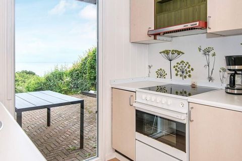 A traditional holiday cottage with a view of the sea from the house and the terrace. The house has a well equipped kitchen and a combined dining and living room, comfortably furnished and with a wood-burning stove, energy saving heat pump and direct ...