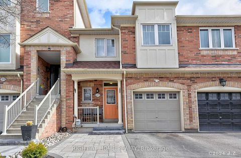 Lovely, Bright and Spacious Freehold Town Home in a quiet family Friendly Neighbour hood. Offers 9ft Ceiling on Main Floor, Large Windows ( lots of Natural Light) and Cosy Gas Fire Place. Kitchen Features Break Fast Bar, and Dining Area, Wood Cabinet...