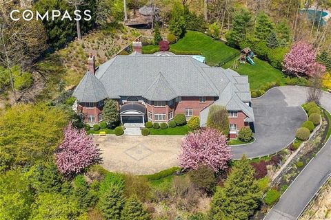Stately stone and brick Colonial sited majestically on 1.75 acres in the coveted Sands Mill Estates of Armonk. No expense had been spared, with exceptional attention to details including 10' ceilings, a two-story entry foyer with sweeping circular st...